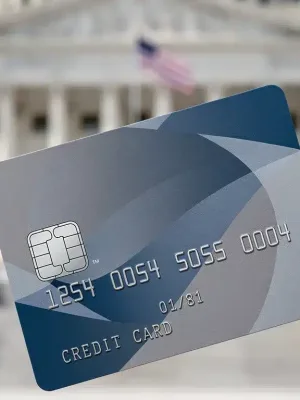 Credit card with U.S. Capitol in background, symbolizing new interest rate cap bill
